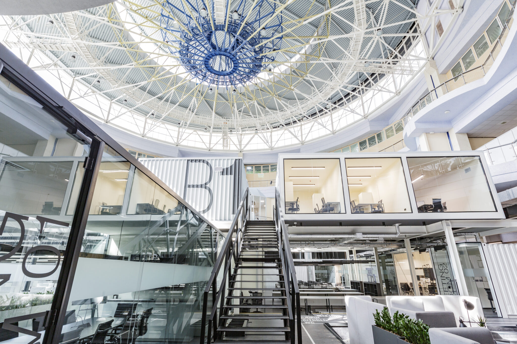 Big coworking space interior with private working cabinets for rent